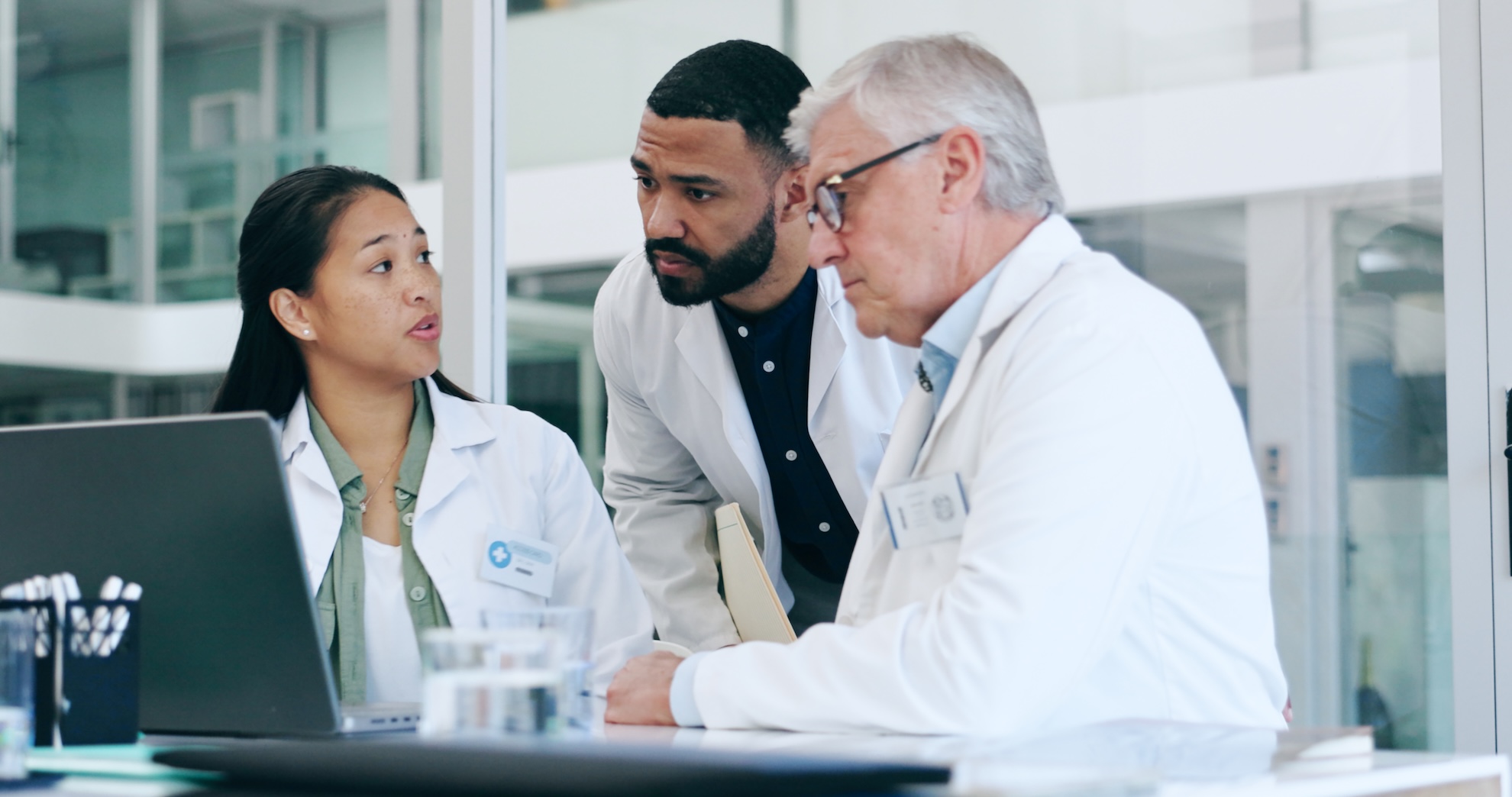 Doctors, medical teamwork and laptop for meeting, planning and solution in hospital or clinic manag.